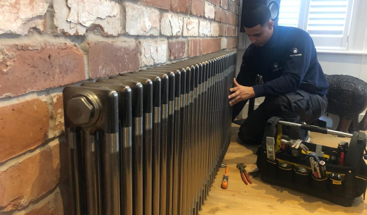 Homecure engineer providing a comprehensive power flush service in [city]