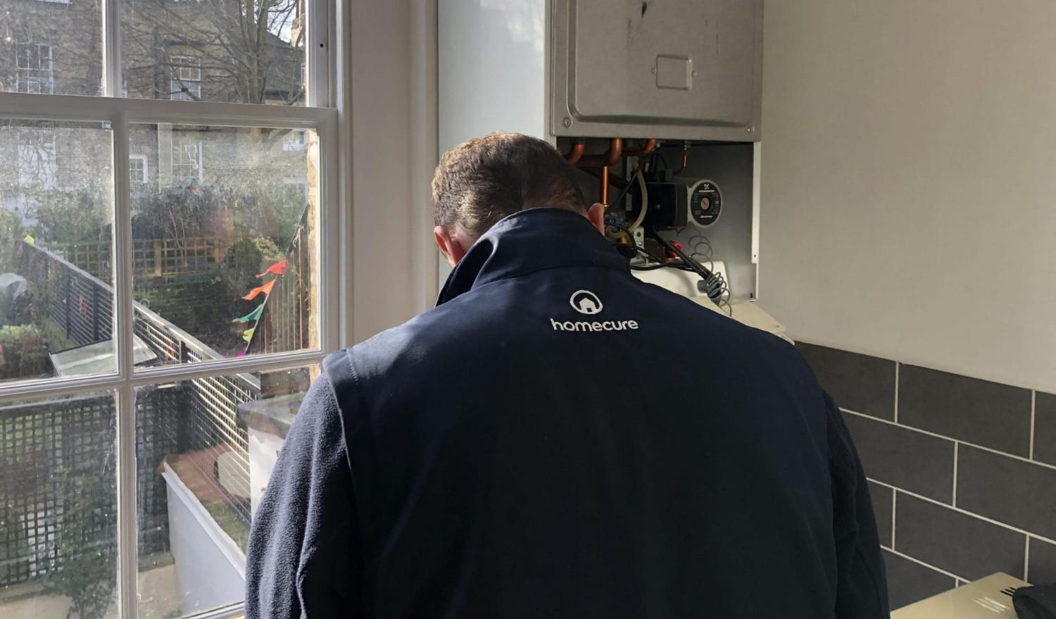 One of our plumbers doing a boiler installation in [city]