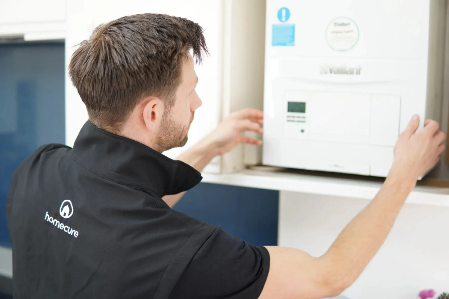 Homecure engineer doing a boiler service in Stoke Newington