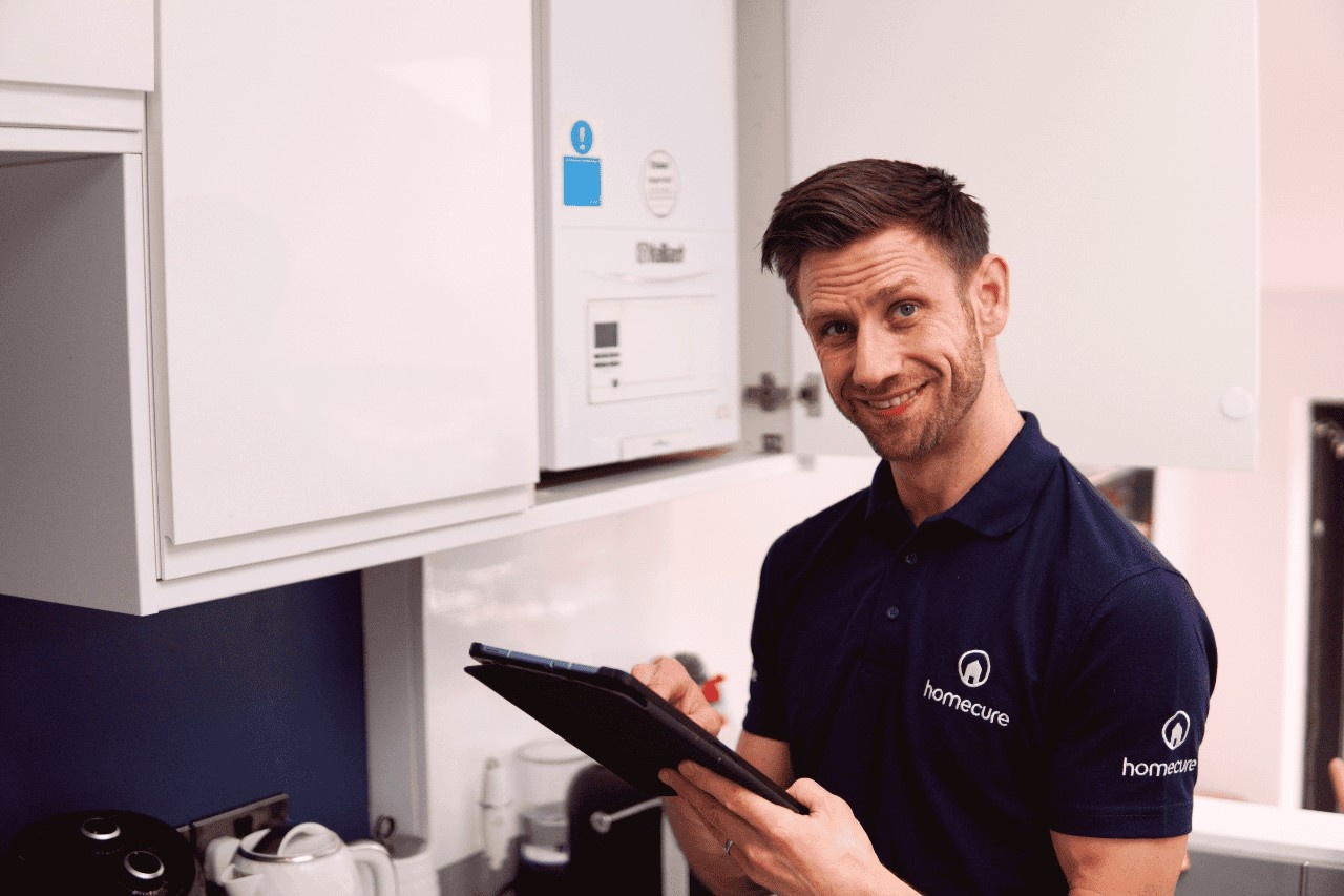 our engineer in East London installing a new boiler